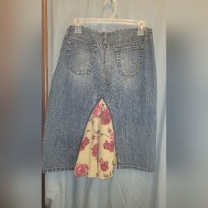 Express denim skirt with floral patch print design. Size 9/10.
